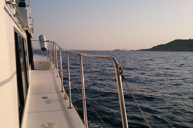 Alcudia 3hr Sunset Trip with Drinks, Tapas, SUP & Snorkel - Alcanada Lighthouse anchor: swim, snorkel, and SUP with sunset in sight