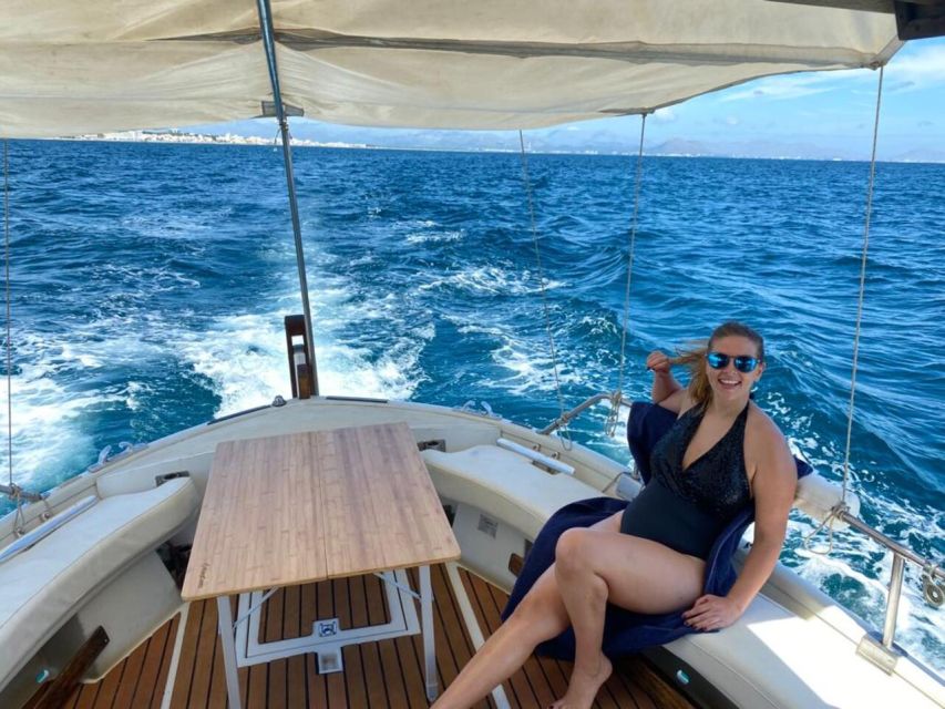 Alcudia: Private Sunset Boat Trip with Glass of Wine & Snack - The llaüt boat experience: comfort, deck time, and a local vibe