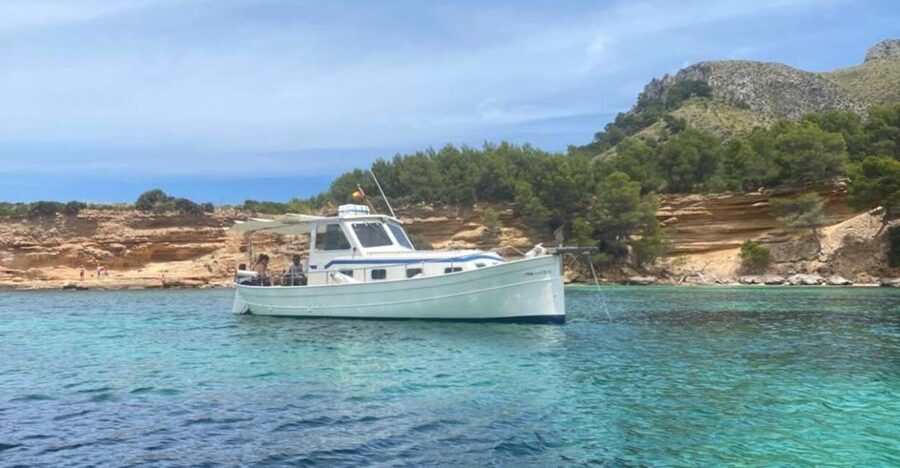 Alcudia: Private Sunset Boat Trip with Glass of Wine & Snack - Alcanada Lighthouse stop: anchoring, snorkeling, and the “wait for sunset” plan
