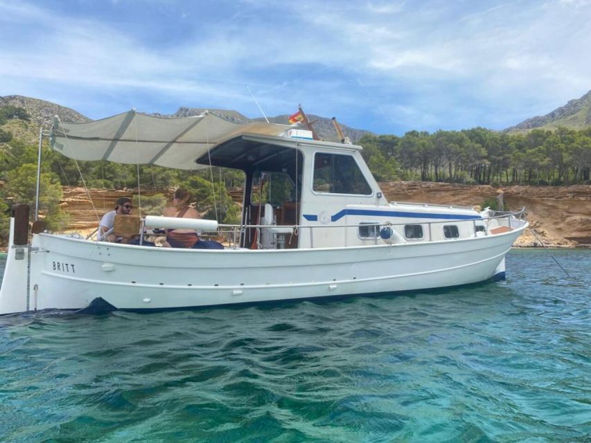 Alcudia: Private Sunset Boat Trip with Glass of Wine & Snack - Getting on board at Bistro Mar and heading out over Alcudia Bay