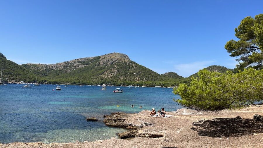 Alcudia: Traditional Wooden Boat Trip with Snorkeling - The coastline cruise: Aucanada Island, Cap Menorca, and cliff views