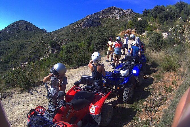 Andratx sightseeing quad tour - Quad setup: helmets, bandanas, and insurance that reduces stress
