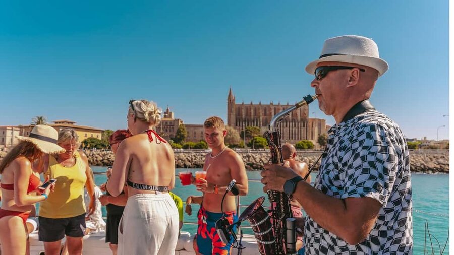 From Magaluf: Palma Bay Sightseeing Cruise with Live Music - Swim Stop in a Secluded Cove, Plus On-Water Fun