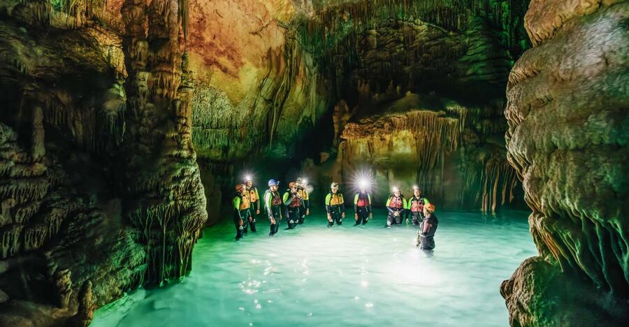 Mallorca: Cova des Coloms Caving Trip with Hotel Transfer - Getting ready for sea caving: wetsuit, helmet, and the reality check