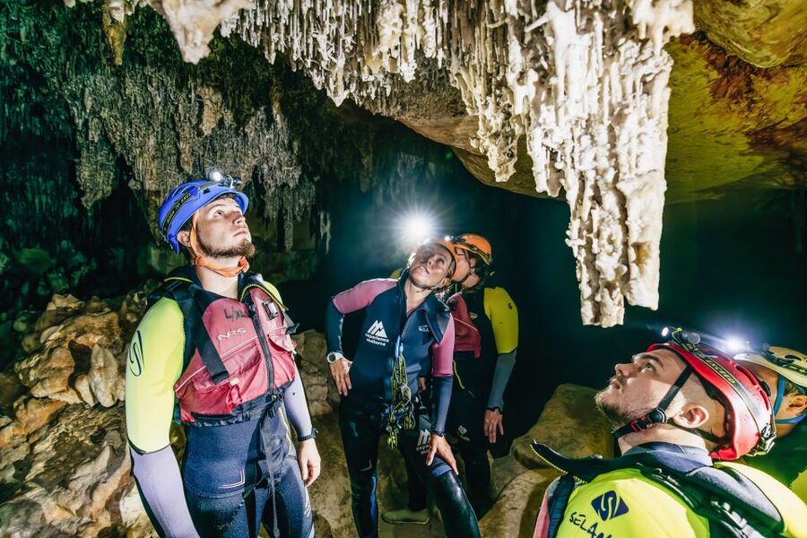 Mallorca: Cova des Coloms Caving Trip with Hotel Transfer - Inside Cova des Coloms: limestone formations, climbing steps, and cave pools
